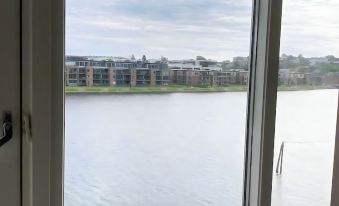 Serene Riverview Apartment Elvegata