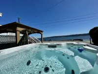 Waterfront Cabin on Camano Island with hot tub and outdoor patio.