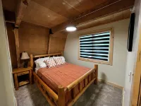 Rustic Riverside A-Frame Retreat: Secluded Charm.