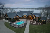Private lakeside retreat with pool, hot tub, and sauna