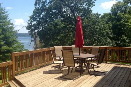 Experience Kentucky Lake out the back door! Spacious 4-bedroom retreat awaits.