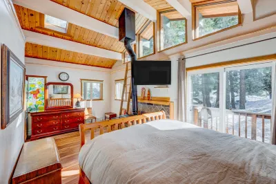 Dog-friendly cabin with private hot tub, fireplace, near skiing & the beach