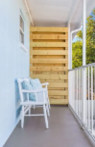 Private Balcony and Tropical Patio Retreat - Stylish Coastal Haven