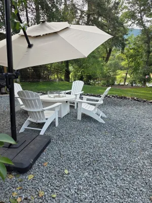 Cozy river cabin with hot tub, great fishing, and peaceful nature views.