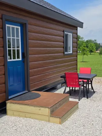 Enjoy cabin #64 at Heritage Acres Park with swimming, splash pad & more!