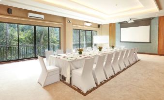 a long dining table set up for a formal event , with multiple chairs arranged around it at The Farm at San Benito