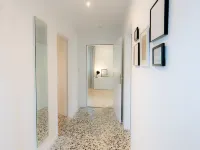 Spacious vacation apartment with garden, surrounded by greenery.