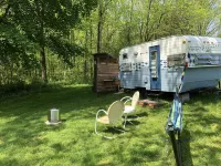 Glamping with sheep in a renovated 1972 Ace camper on 48 acres