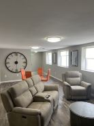 Contemporary 1400 sq ft Space in Lower Level Open Concept Gas Burning Fireplace