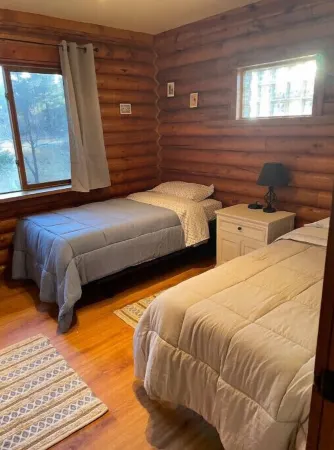 Cheerful Cabin with large stone patio and hot tub, next to trails!!