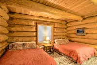 Luxury Riverfront Log Cabin Near Stevens Pass with Hot Tub & Two-Story Fireplace