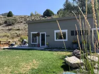 Little Den is an efficiency, cabin located on the Big Laramie River.