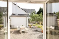 "Brunnenhaus": Stylish vacation home with Mediterranean courtyard and huge garden