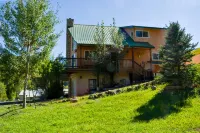 Charming Creekside Escape with Hot Tub and Two Kitchens - Cozy Haven