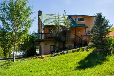 Charming Creekside Escape with Hot Tub and Two Kitchens - Cozy Haven