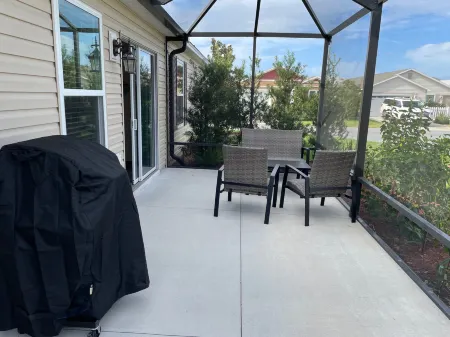 Charming Corner Lot with Golf Cart and Screened Lanai - Inviting Escape