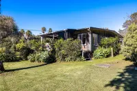 Drop Anchor at Enclosure Bay Beach by Waiheke Unlimited Hotels near Waiheke Musical Museum