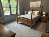 BEAUTIFUL lake front home with a private beach, dock and large yard