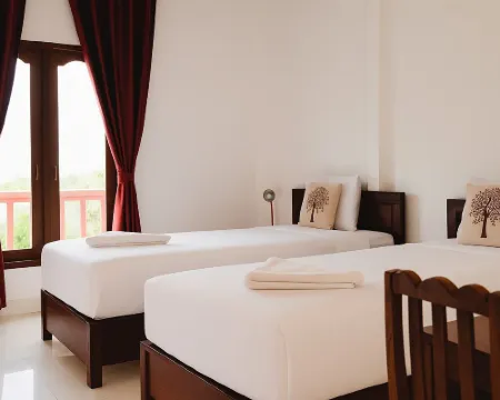 ศรีปันยา เกสต์เฮาส์ โรงแรมในโพนสะหวัน