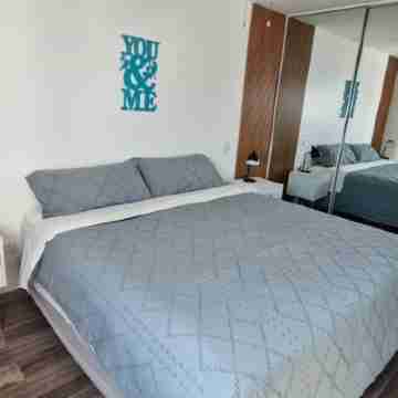 Two Bedroom condo with ocean breeze and city view. Rooms