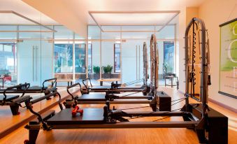 a large room filled with various exercise equipment , including a rowing machine and a treadmill at The Westin Riverfront Resort & Spa, Avon, Vail Valley