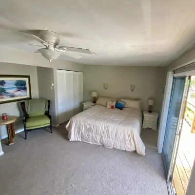 Welcome to White Sands Getaway just 50 steps to a beach Paradise! Sunset views!