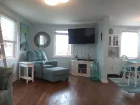 Beach and river view cottage with deck and specatuclar views.