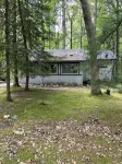 Quaint and cozy log  and knotty pine cabin close to lakes.