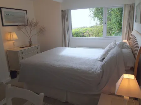 Beach front location, Pet friendly, Full of charachter, Private garden, Sea view