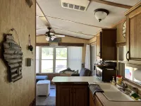 Parkmodel cabin w screened porch in campground on bike trail.