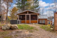 Rarely offered 2 waterfront cottages with 2 hot tubs side by side!
