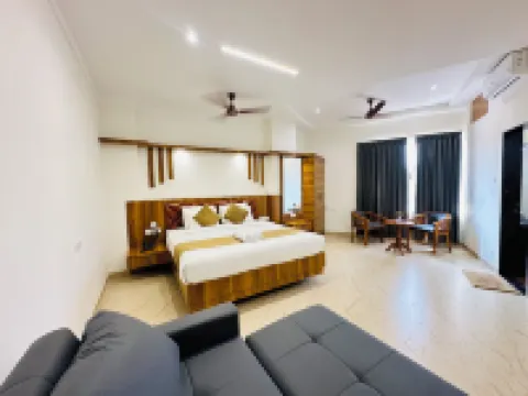 Shambhavi Hotel & Convention Centre Hotels near Adarsh Complex