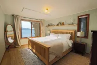 Private Waterfront Spa Retreat + Movie Theater