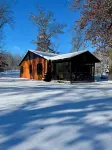 Cozy 2 bedroom cabin with fireplace steps to sand bottom swimming and lake views