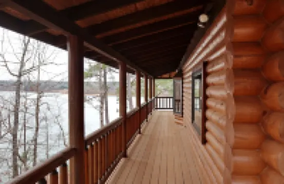 Large six-bedroom loghome w/ private boat ramp, dock, movie room and pool room.