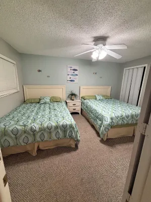 The beach is your backyard! Family size condo on Indian Shores! Sleeps 10!