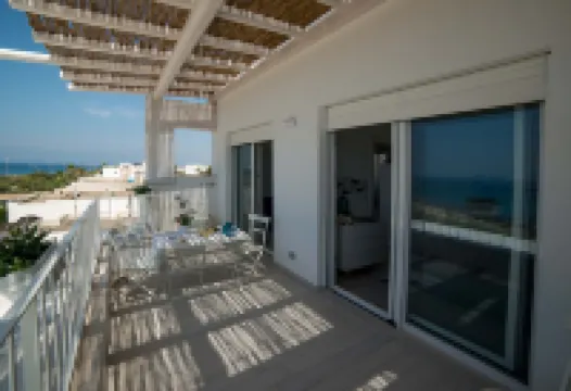 Beachfront 2nd floor apartment with terrace located east with sunset