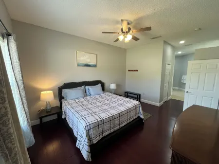 Modern and spacious getaway with a pool and grill