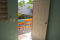 An amazing apartment with green area, garden with teable and chairs in the best