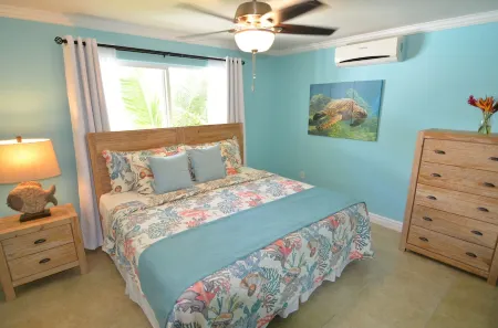 Oceanfront beach house with dual-masters & screened balcony on West Bay Beach