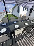 Relax here with beach views, steps to the beach, fenced in yard, pet friendly