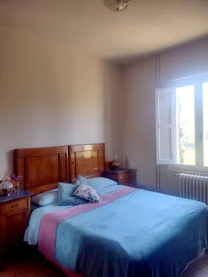 Accommodation nestled in the countryside, with natural landscapes, and meadows.