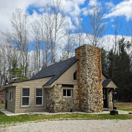Escape to "The Woods": A Secluded Stone Cabin Retreat.
