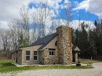Escape to "The Woods": A Secluded Stone Cabin Retreat.