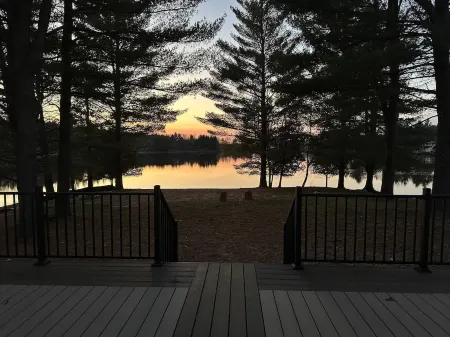 1/2 acre, 450 feet of lake frontage and a sandy beach with sunsets!