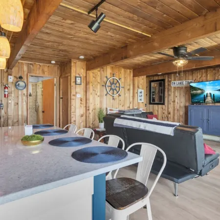 Cozy 3BR lakefront cottage with hot tub perfect for families w/ private dock.