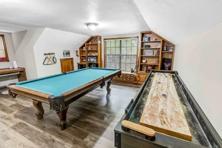 Enjoy 1.3 wooded acres and location to amenities Holly Lake has to offer.