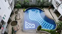 Cozy Living and Tidy 2Br at Puncak Dharmahusada Apartment - Condos