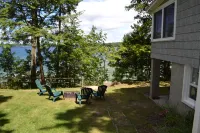 Cozy Cottage with Lake Views and Outdoor Fire Pit - Charming Escape Hotels in Long Lake Township