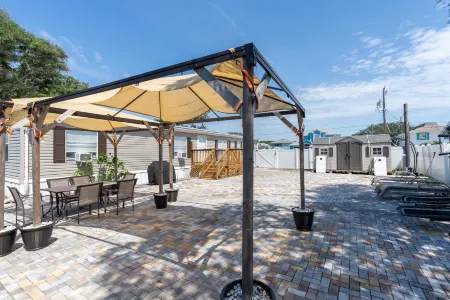 Canal Front Access and Outdoor Patio - Charming Beachside Retreat